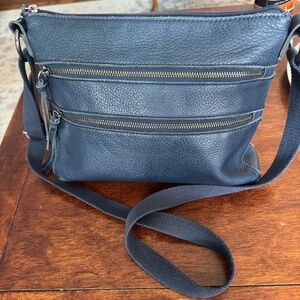 The Sak Reseda Navy leather crossbody with adjustable strap